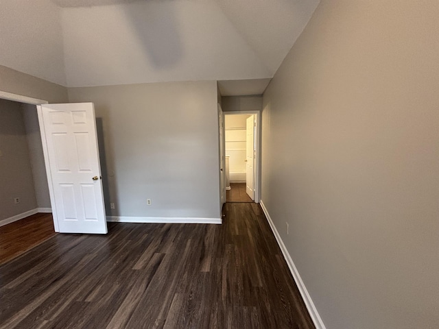 4334 Cleopatra Rd, Unicorp/Memphis, TN 38128 - unfurnished bedroom featuring vaulted ceiling, dark wood-type flooring, and baseboards