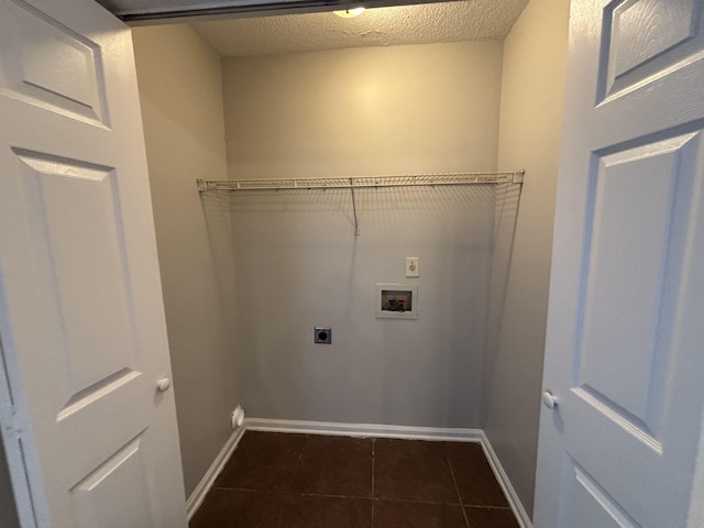 4334 Cleopatra Rd, Unicorp/Memphis, TN 38128 - washroom featuring electric dryer hookup, hookup for a washing machine, baseboards, dark tile patterned flooring, and a textured ceiling