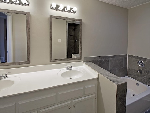 bathroom featuring a garden tub and double vanity