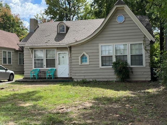 3465 Spottswood Ave, Memphis, TN 38111 - view of front facade featuring a chimney, a front lawn, and a shingled roof