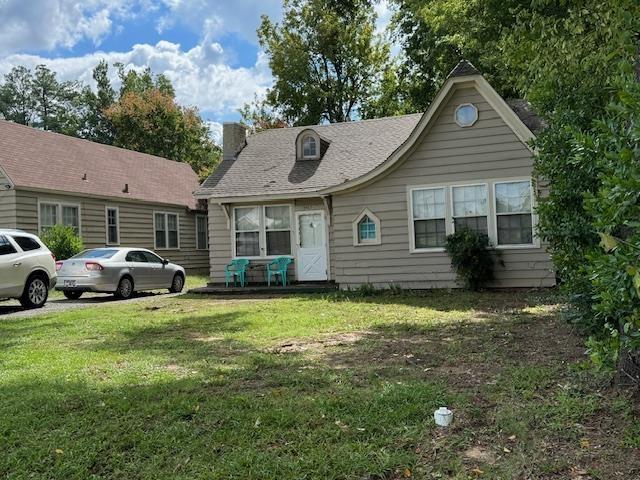 3465 Spottswood Ave, Memphis, TN 38111 - view of front of home with a chimney and a front lawn