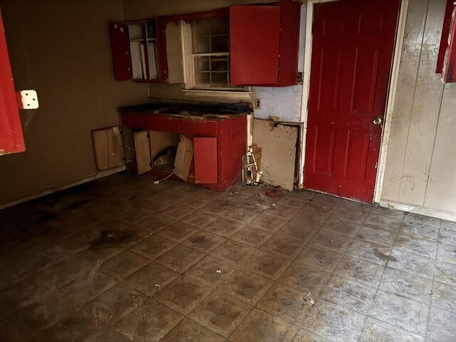 3264 Madewell St, Memphis, TN 38127 - kitchen with red cabinets and dark countertops