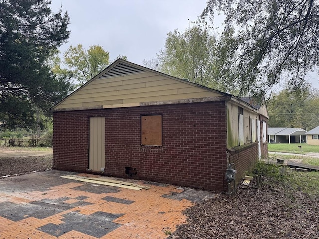 3264 Madewell St, Memphis, TN 38127 - view of side of property featuring brick siding and a patio