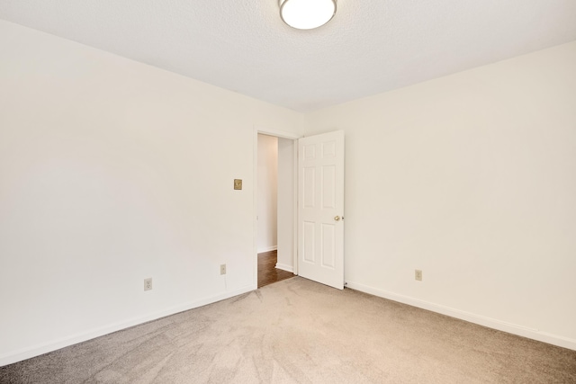 9234 Fletcher Trace Pkwy, Lakeland, TN 38002 - unfurnished room featuring light colored carpet and baseboards