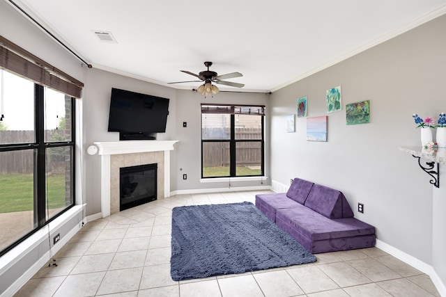 13525 Lapstone Loop, Olive Branch, MS 38654 - living area with light tile patterned flooring, a ceiling fan, ornamental molding, a fireplace, and baseboards