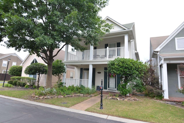 1342 Harbor Park Dr, Memphis, TN 38103 - view of front of house with a balcony, covered porch, and a front lawn