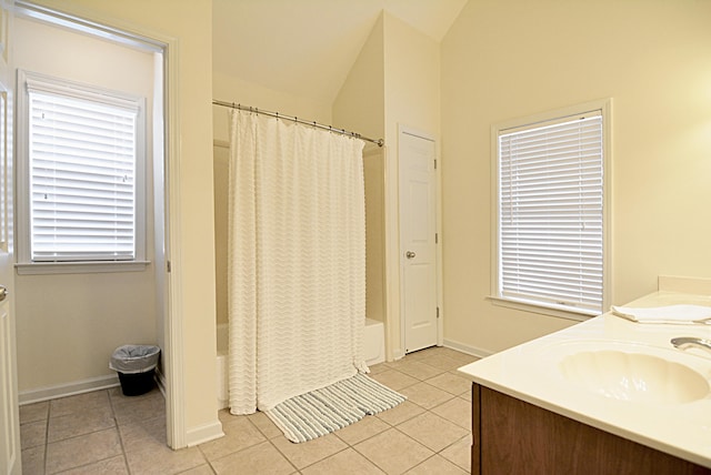 1342 Harbor Park Dr, Memphis, TN 38103 - full bathroom featuring tile patterned flooring, vaulted ceiling, shower / bath combination with curtain, and double vanity