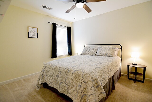 1342 Harbor Park Dr, Memphis, TN 38103 - bedroom featuring light colored carpet, baseboards, and a ceiling fan