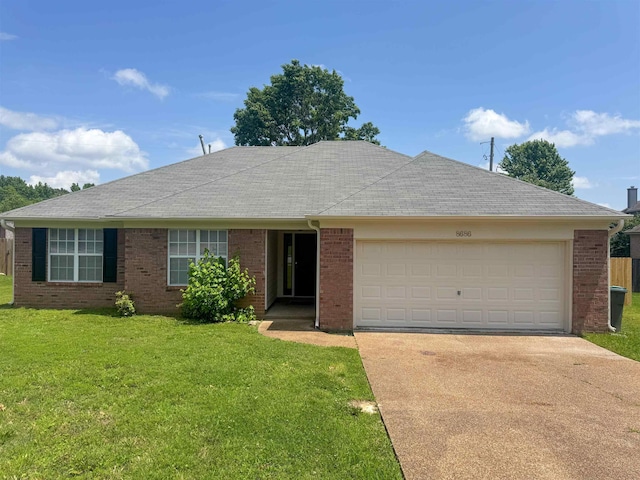 single story home with driveway, a garage, a front yard, brick siding, and roof with shingles