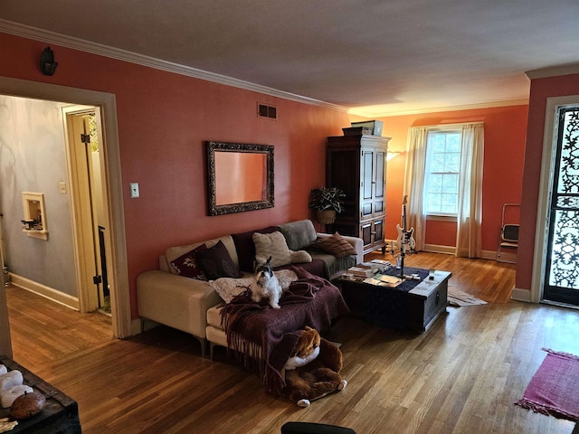 1993 Higbee Ave, Memphis, TN 38104 - living area featuring wood finished floors, ornamental molding, and baseboards