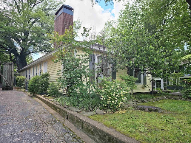 1993 Higbee Ave, Memphis, TN 38104 - view of property exterior featuring a chimney