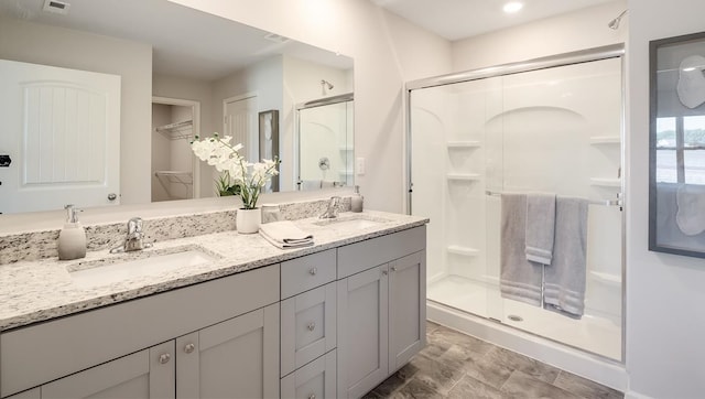 8005 Royster Creek Dr E, Millington, TN 38053 - bathroom with a shower stall, double vanity, and a spacious closet