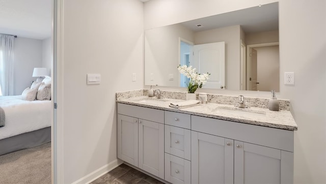 8005 Royster Creek Dr E, Millington, TN 38053 - ensuite bathroom featuring baseboards and double vanity