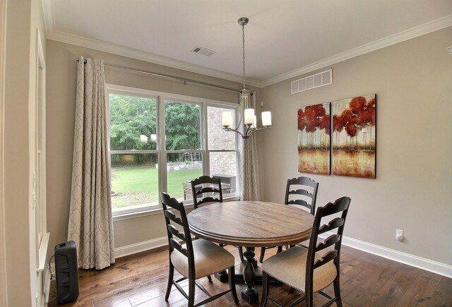 75 Windgrove Cv, Piperton, TN 38017 - dining space with dark wood-style floors, baseboards, crown molding, and a chandelier