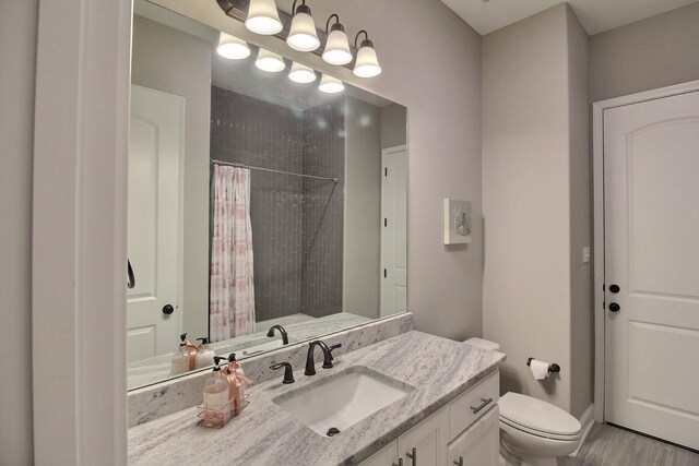 75 Windgrove Cv, Piperton, TN 38017 - full bathroom featuring toilet, a shower with curtain, vanity, and wood finished floors