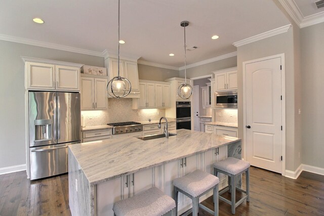 75 Windgrove Cv, Piperton, TN 38017 - kitchen featuring stainless steel appliances, a sink, baseboards, recessed lighting, and dark wood-style flooring