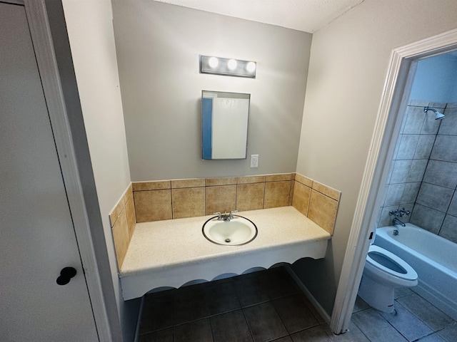 2232 Amethyst Cv, Memphis, TN 38127 - full bathroom featuring a sink, tile patterned flooring, toilet, and bathing tub / shower combination