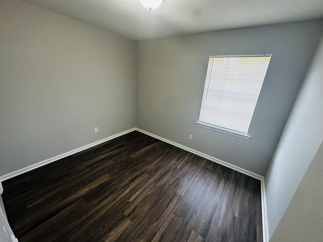 2232 Amethyst Cv, Memphis, TN 38127 - empty room with dark wood-style floors and baseboards