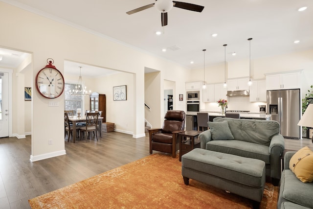 6423 Osier Cv, Bartlett, TN 38135 - living area featuring crown molding, a ceiling fan, stairs, recessed lighting, and wood finished floors