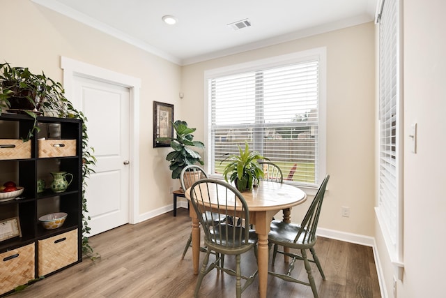 6423 Osier Cv, Bartlett, TN 38135 - dining area featuring wood finished floors, ornamental molding, and baseboards