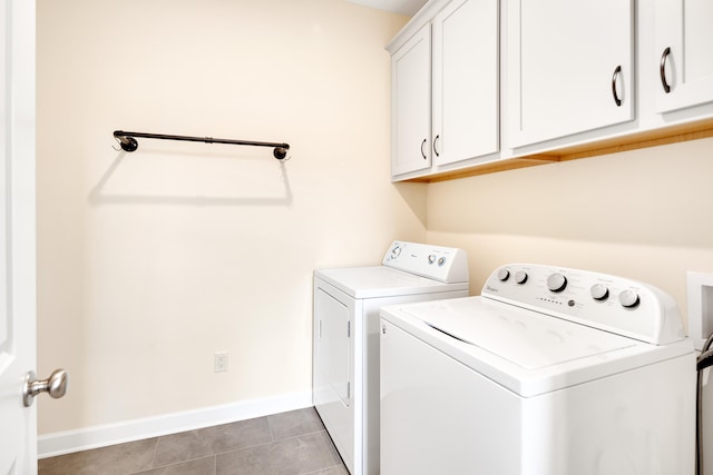 6423 Osier Cv, Bartlett, TN 38135 - laundry room featuring cabinet space, independent washer and dryer, light tile patterned floors, and baseboards