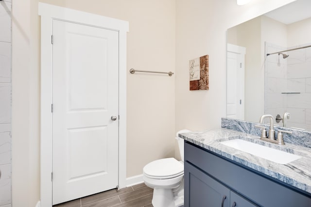 6423 Osier Cv, Bartlett, TN 38135 - bathroom with vanity, toilet, wood tiled floors, baseboards, and a shower