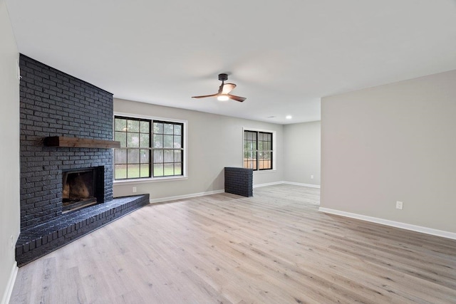 6410 Coteswood Rd, Memphis, TN 38134 - unfurnished living room featuring ceiling fan, wood finished floors, baseboards, and a fireplace