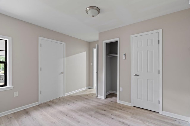 6410 Coteswood Rd, Memphis, TN 38134 - unfurnished bedroom featuring light wood finished floors and baseboards