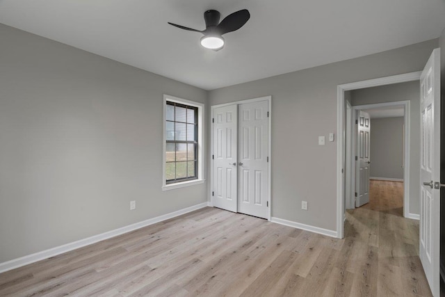 6410 Coteswood Rd, Memphis, TN 38134 - unfurnished bedroom with light wood-style floors, baseboards, a closet, and ceiling fan