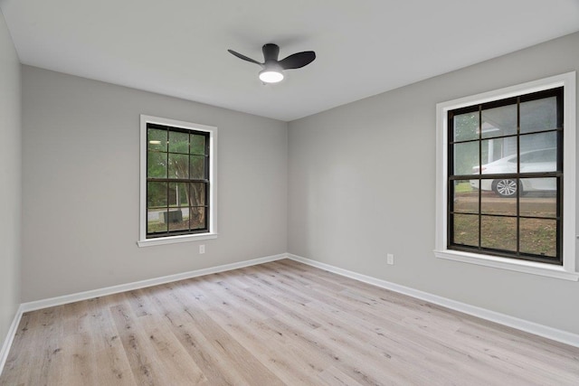 6410 Coteswood Rd, Memphis, TN 38134 - empty room featuring plenty of natural light, light wood-style flooring, and baseboards