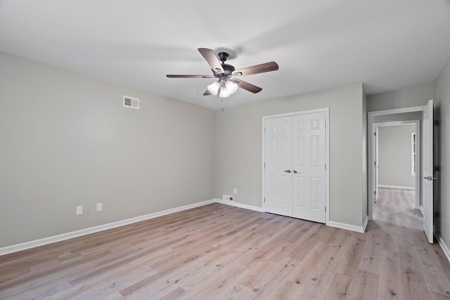 6410 Coteswood Rd, Memphis, TN 38134 - unfurnished bedroom featuring light wood finished floors, baseboards, a closet, and a ceiling fan