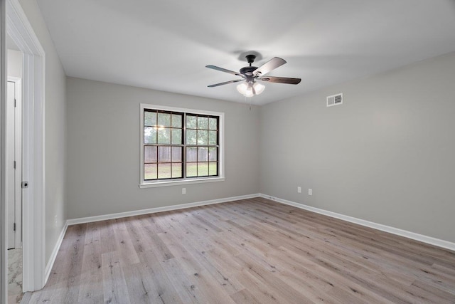 6410 Coteswood Rd, Memphis, TN 38134 - empty room featuring wood finished floors, ceiling fan, and baseboards