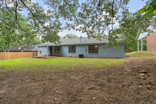 6410 Coteswood Rd, Memphis, TN 38134 - rear view of house with a patio, a chimney, central AC unit, and brick siding