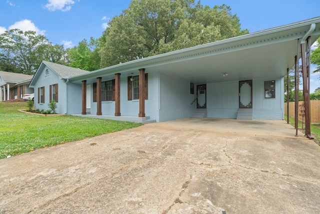 6410 Coteswood Rd, Memphis, TN 38134 - view of front of property with brick siding, a carport, and concrete driveway