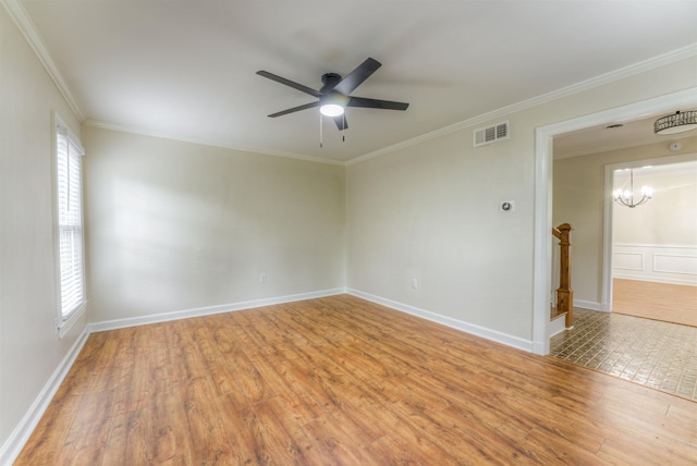 7238 Mcvay Rd, Germantown, TN 38138 - unfurnished room featuring wood finished floors, plenty of natural light, ceiling fan, ornamental molding, and a chandelier