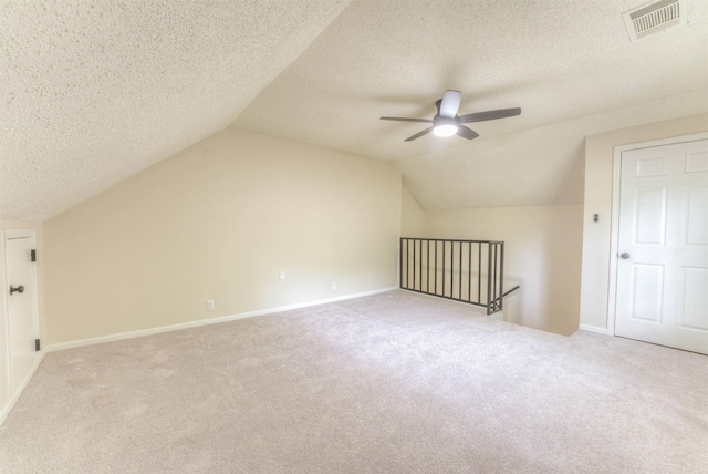 7238 Mcvay Rd, Germantown, TN 38138 - additional living space with a ceiling fan, carpet, vaulted ceiling, a textured ceiling, and baseboards