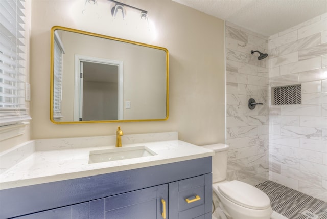 7238 Mcvay Rd, Germantown, TN 38138 - full bath featuring toilet, vanity, a tile shower, and a textured ceiling