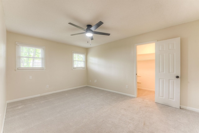 7238 Mcvay Rd, Germantown, TN 38138 - spare room featuring light colored carpet, ceiling fan, and baseboards