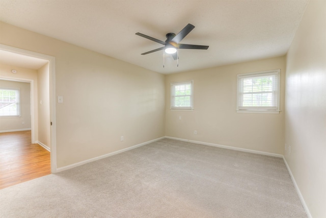 7238 Mcvay Rd, Germantown, TN 38138 - unfurnished room featuring light colored carpet, a ceiling fan, and baseboards