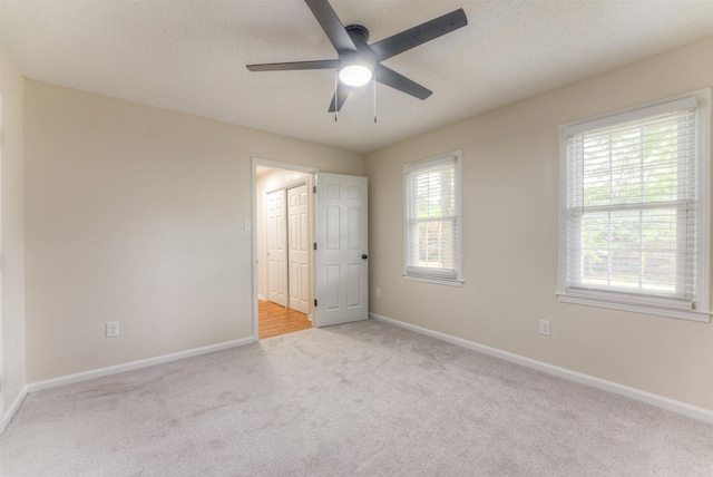 7238 Mcvay Rd, Germantown, TN 38138 - unfurnished bedroom featuring carpet flooring, baseboards, a ceiling fan, and a textured ceiling