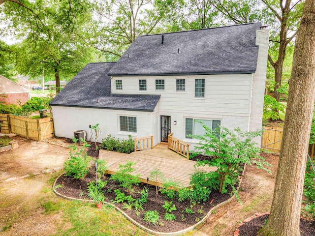 7238 Mcvay Rd, Germantown, TN 38138 - back of property featuring fence, brick siding, a shingled roof, a deck, and central AC unit