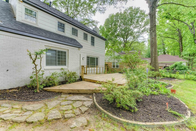 7238 Mcvay Rd, Germantown, TN 38138 - rear view of house featuring brick siding, a wooden deck, and a chimney