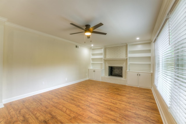 7238 Mcvay Rd, Germantown, TN 38138 - unfurnished living room with plenty of natural light, ceiling fan, light wood-style flooring, crown molding, and recessed lighting