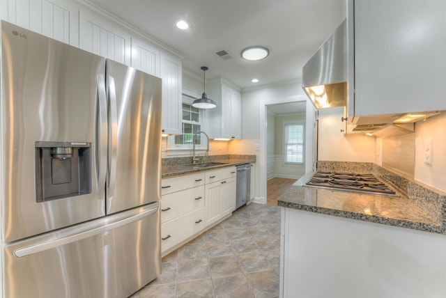 7238 Mcvay Rd, Germantown, TN 38138 - kitchen with stainless steel appliances, a sink, white cabinetry, dark stone counters, and hanging light fixtures