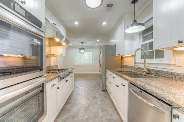 7238 Mcvay Rd, Germantown, TN 38138 - kitchen featuring appliances with stainless steel finishes, a sink, white cabinetry, and recessed lighting