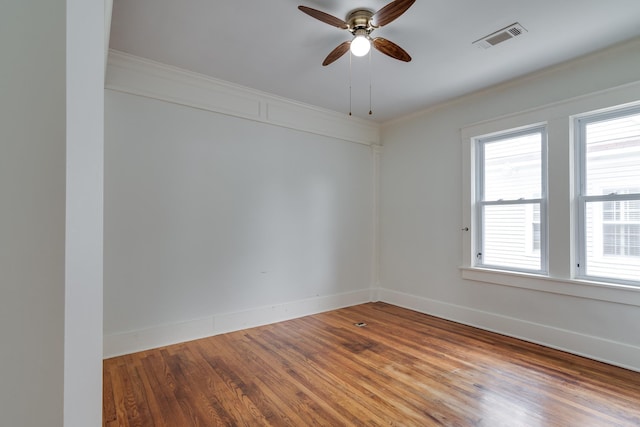 2080 Vinton Ave, Memphis, TN 38104 - spare room with wood finished floors, plenty of natural light, ceiling fan, ornamental molding, and baseboards