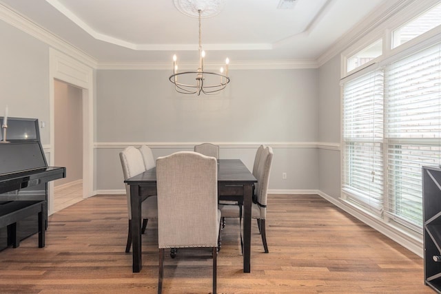 1796 Campden Dr, Collierville, TN 38017 - dining area with a tray ceiling, a chandelier, light wood-style flooring, and baseboards