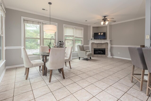 1796 Campden Dr, Collierville, TN 38017 - dining room featuring light tile patterned flooring, crown molding, healthy amount of natural light, and ceiling fan