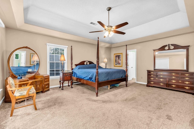 858 Gunnison Dr, Collierville, TN 38017 - carpeted bedroom featuring a tray ceiling, baseboards, and a ceiling fan