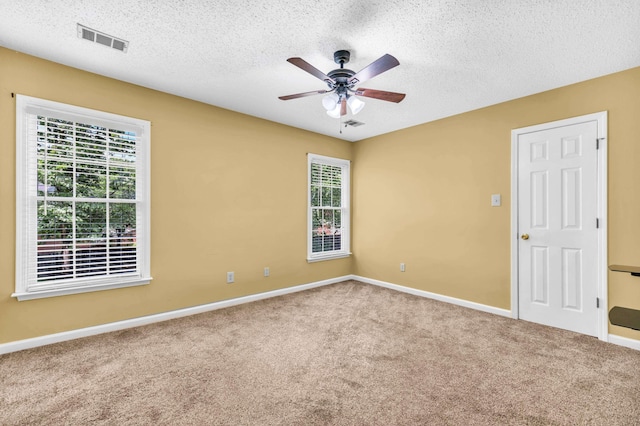 858 Gunnison Dr, Collierville, TN 38017 - unfurnished room with plenty of natural light, ceiling fan, carpet, a textured ceiling, and baseboards